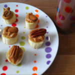 Banana topped with peanut butter with honey and assorted nuts. KDD low fat chocolate milk. Breakfast 10.7.12
